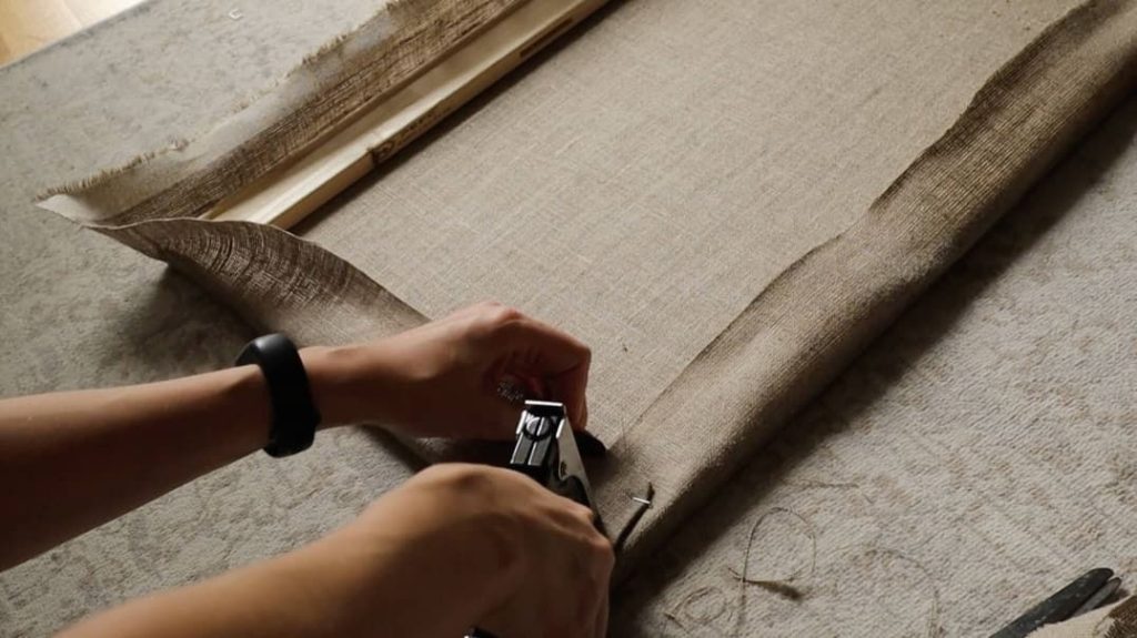 stapling corners of the canvas